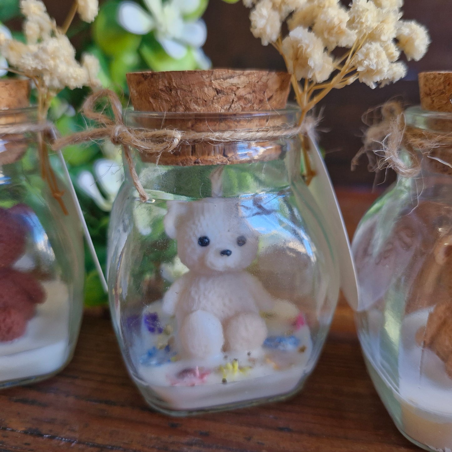 Vela decorativa aromática con osito en frasco con tapa de corcho